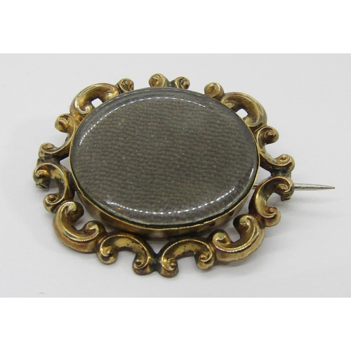 337 - Group of antique brooches comprising a Victorian yellow metal mourning brooch containing woven hair,... 