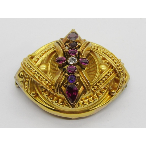 339 - Victorian yellow metal Etruscan Revival style brooch set with garnets, 4.6cm W approx, 12.5g