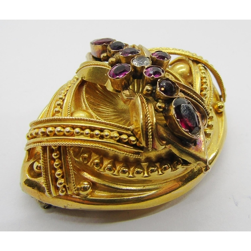 339 - Victorian yellow metal Etruscan Revival style brooch set with garnets, 4.6cm W approx, 12.5g