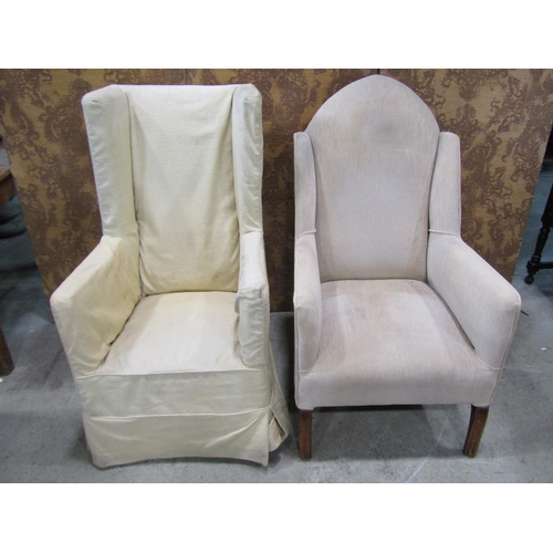 1272 - An Edwardian wing chair with arched back raised on simple chamfered supports together with An Edward... 