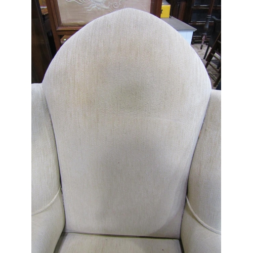 1272 - An Edwardian wing chair with arched back raised on simple chamfered supports together with An Edward... 