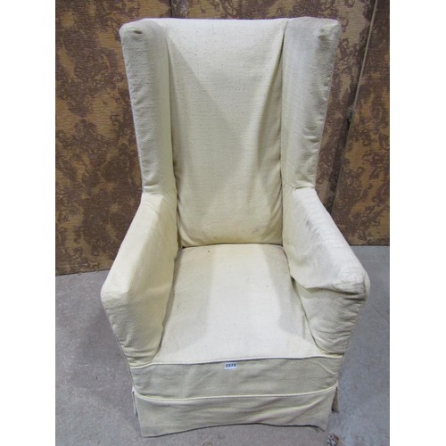 1272 - An Edwardian wing chair with arched back raised on simple chamfered supports together with An Edward... 