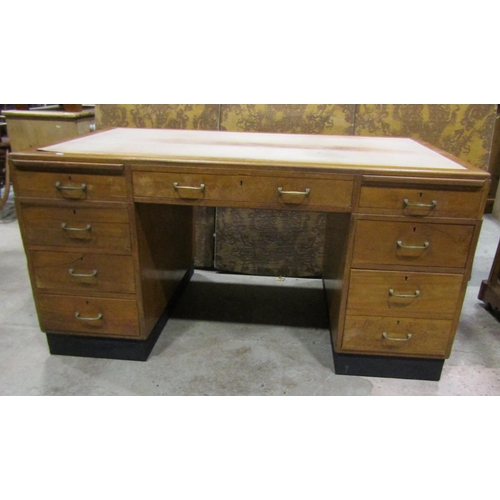 1214 - A Mid 20th century kneehole desk with nine drawers and inset leather top, 150cm 93cm, 88cm high