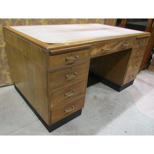 1214 - A Mid 20th century kneehole desk with nine drawers and inset leather top, 150cm 93cm, 88cm high