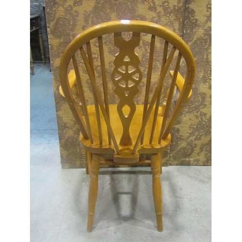 1110 - A set of six modern beech Windsor wheel back dining chairs (4&2)