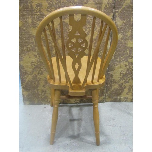 1110 - A set of six modern beech Windsor wheel back dining chairs (4&2)