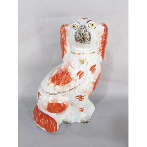 111 - 19th century Staffordshire spaniel with rust coloured patches and four decorative Doulton series war... 