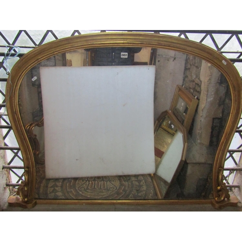 1324 - 19th century gilded overmantle mirror with shaped frame and scrolled detail, 95cm x 130cm