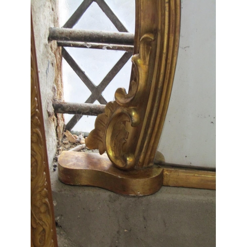 1324 - 19th century gilded overmantle mirror with shaped frame and scrolled detail, 95cm x 130cm