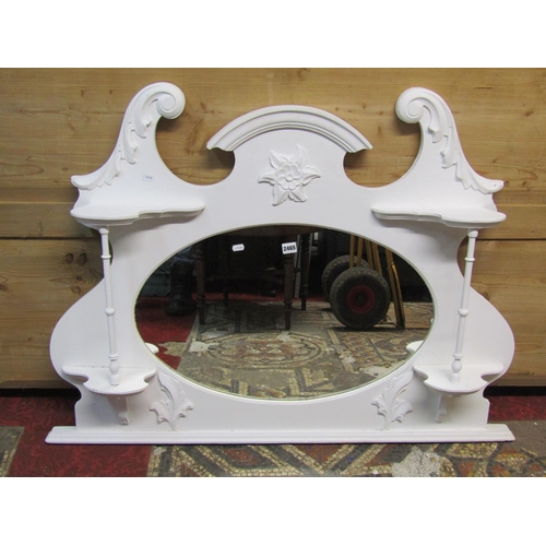 1325 - An Edwardian overmantle mirror with shaped outline and later painted finish