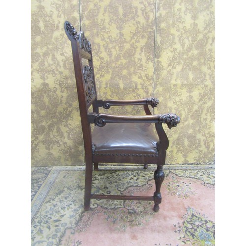 1430 - 19th century carved oak elbow chair with armorial detail and lions mask, hide upholstered seat