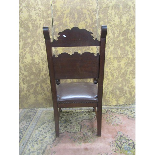 1430 - 19th century carved oak elbow chair with armorial detail and lions mask, hide upholstered seat