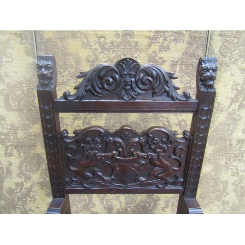 1430 - 19th century carved oak elbow chair with armorial detail and lions mask, hide upholstered seat