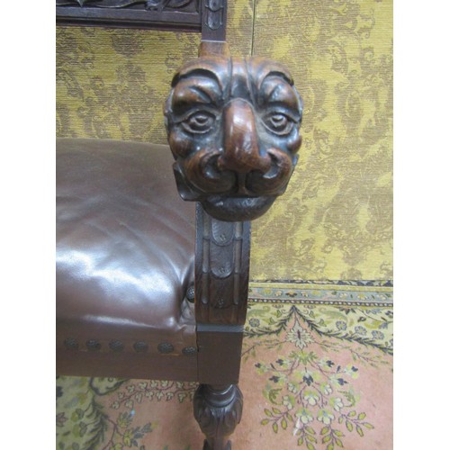 1430 - 19th century carved oak elbow chair with armorial detail and lions mask, hide upholstered seat