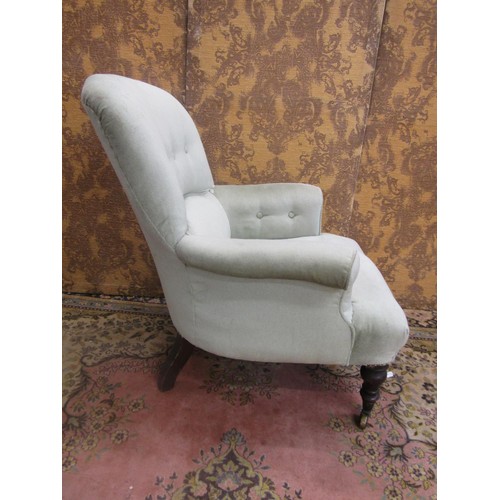 1433 - An Edwardian drawing room chair with later upholstered finish, buttoned back on turned forelegs