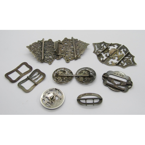 411 - Collection of antique silver buckles and buttons, to include a late Victorian button depicting a gar... 