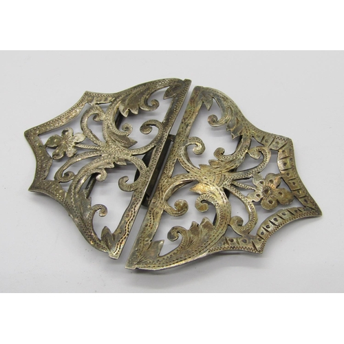 411 - Collection of antique silver buckles and buttons, to include a late Victorian button depicting a gar... 