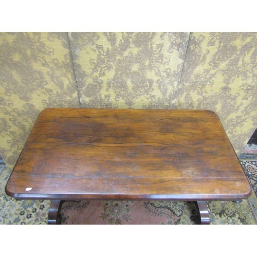 1445 - Regency rosewood centre table of rectangular form raised on scrolled supports with central rail, 71c... 