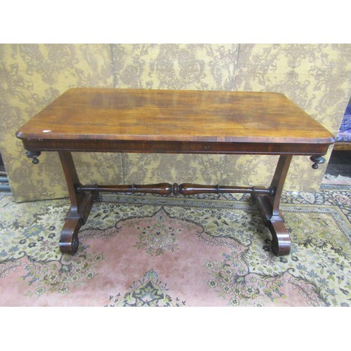 1445 - Regency rosewood centre table of rectangular form raised on scrolled supports with central rail, 71c... 