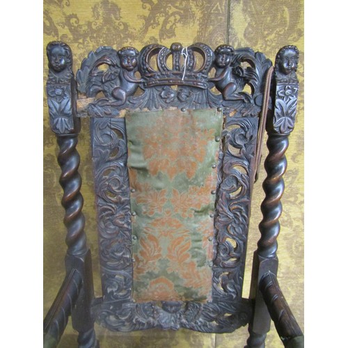 1451 - Carolean carved walnut elbow chair with pierced cresting rail and later upholstered panel