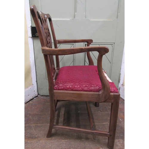 1455 - A Georgian mahogany elbow chair with pierced splat, drop in seat on square cut supports together wit... 