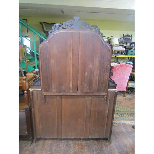 1459 - A Victorian walnut chiffonier with mirror panelled base and raised mirror back and marble top, 120cm... 