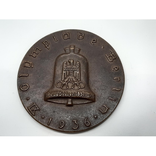 469 - A 1936 Berlin Olympic participants medallion, designed by Otto Placzek, in seemingly original fitted... 