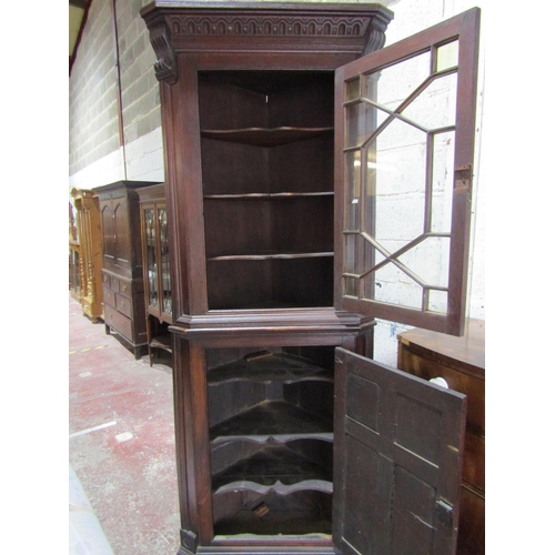 1353 - Antique Welsh oak freestanding corner cupboard in two sections.  Astral glazed upper door and furthe... 