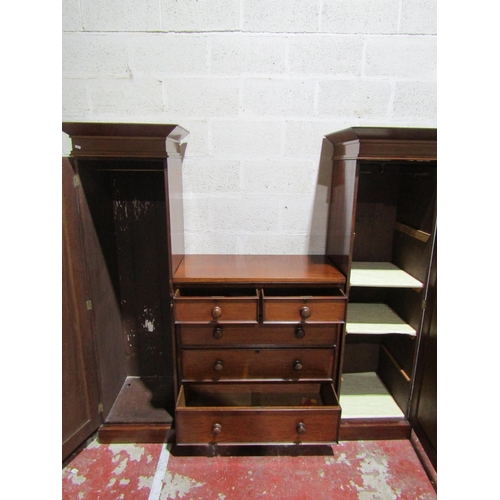 1358 - A sentry box wardrobe, the middle section fitted with three long and two short drawers flanked by tw... 