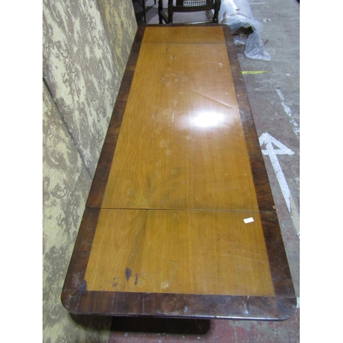 1374 - A Victorian sofa table, cross banded and on stretcher framework.
110cm wide when closed