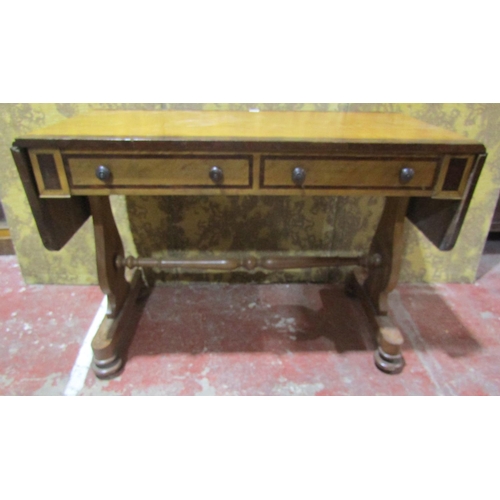 1374 - A Victorian sofa table, cross banded and on stretcher framework.
110cm wide when closed