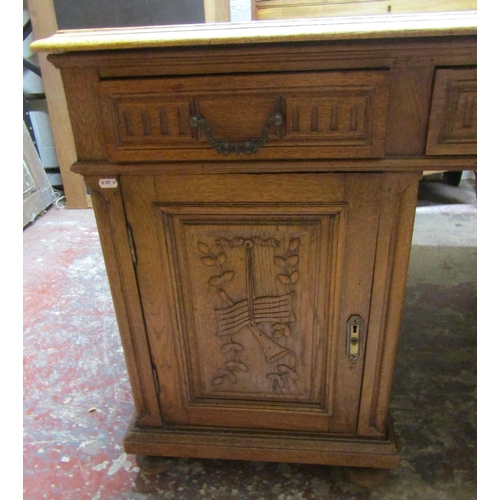 1402 - Late 19th century pedestal oak writing desk to each side three drawers and two cupboards with carved... 