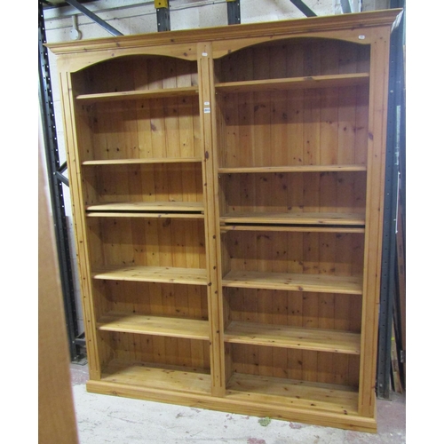 1404 - A contemporary pine double  bookcase
containing 12 adjustable shelves, 170 cm in length x 205 cm in ... 