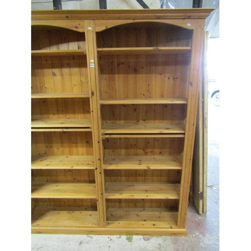 1404 - A contemporary pine double  bookcase
containing 12 adjustable shelves, 170 cm in length x 205 cm in ... 