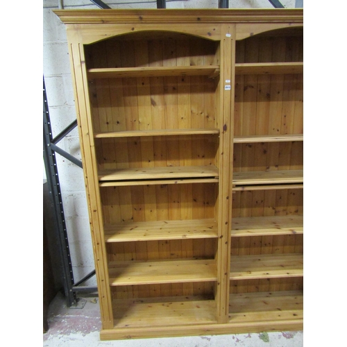 1404 - A contemporary pine double  bookcase
containing 12 adjustable shelves, 170 cm in length x 205 cm in ... 