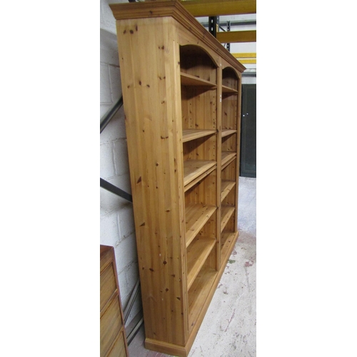 1404 - A contemporary pine double  bookcase
containing 12 adjustable shelves, 170 cm in length x 205 cm in ... 