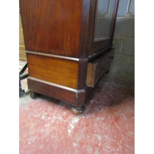 1415 - 19th century mahogany wardrobe with mirror panelled door over a single frieze drawer of knockdown fo... 