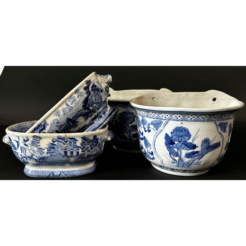 113 - Blue and white ceramic 'Royal Granite' meat platter, two Chinese wall planters, two willow pattern d... 