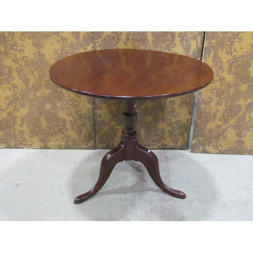 1469 - A large 19th century tripod table with a one piece top, 85cm diameter, 73cm cm high