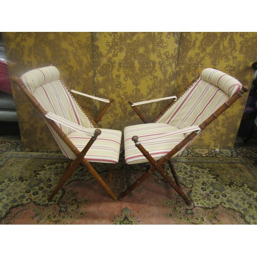 1470 - A pair of Edwardian folding simulated bamboo chairs, with reupholstered finish