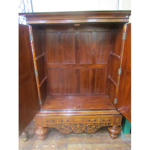 1471 - A good quality colonial hanging cupboard in mahogany and inlaid with ebony, the panelled doors over ... 