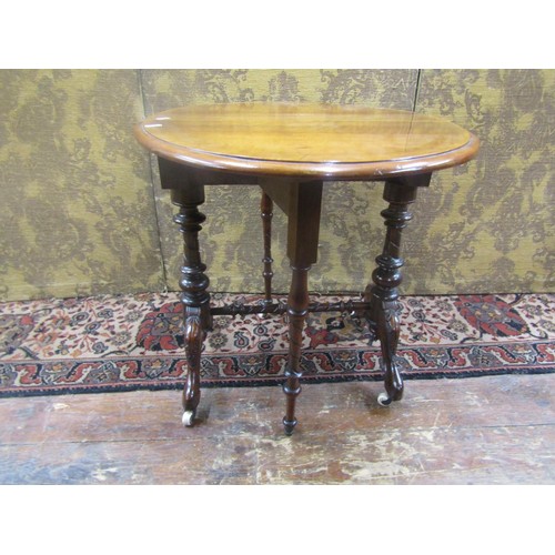 1476 - Small Victorian walnut drop leaf occasional table on turned supports, 56cm high, 55cm diameter