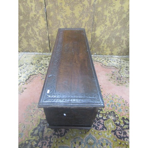 1482 - An antique oak six plank coffer with geometric carved detail finish, 48cm high, 125cm x 40cm