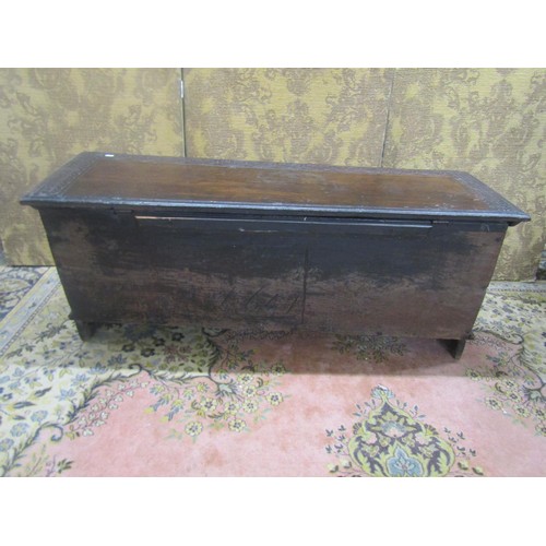 1482 - An antique oak six plank coffer with geometric carved detail finish, 48cm high, 125cm x 40cm