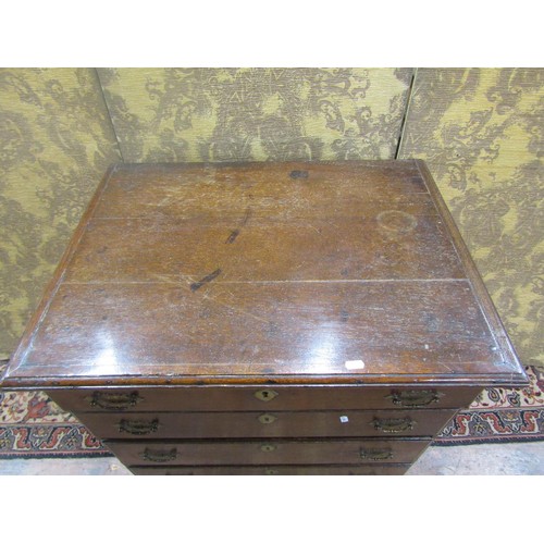 1487 - A small George III  oak country made chest of four long drawers of diminutive proportions, with bras... 