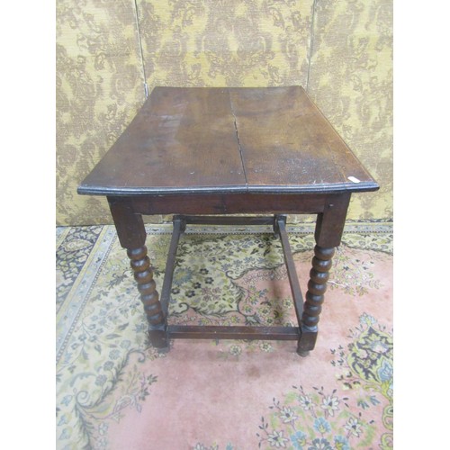 1489 - An 18th century country oak side table the frieze drawer with repeating carving detail raised on bob... 