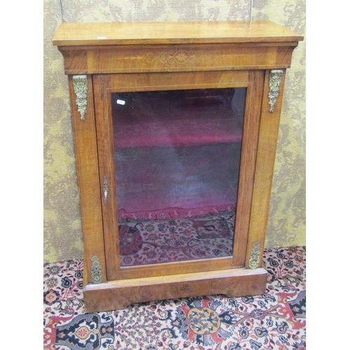 1499 - A 19th century pier cabinet enclosed by a glazed panelled door with applied cast brass fittings on a... 