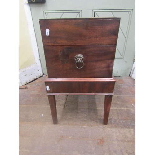 1500 - A Georgian mahogany box on stand, the rising lid revealing a segmented interior set on an open frame... 