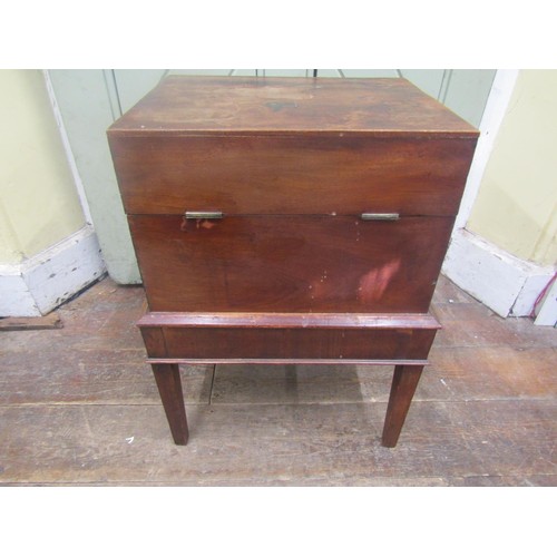 1500 - A Georgian mahogany box on stand, the rising lid revealing a segmented interior set on an open frame... 