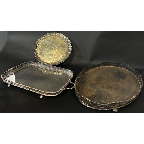 220 - A mixed selection of silver plated items, including a scalloped edged salver, a galleried drinks tra... 